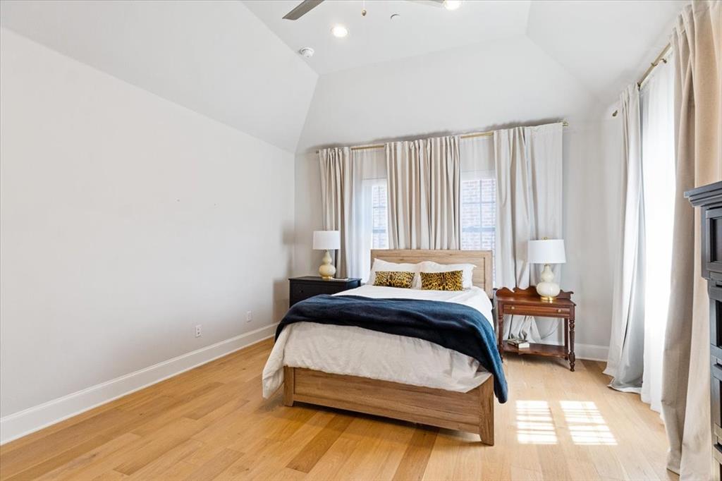 4129 Runyon Road Addison, TX 75001 - Photo 24 of 38 Bedroom featuring lofted ceiling, light wood-style flooring, a ceiling fan, and recessed lighting