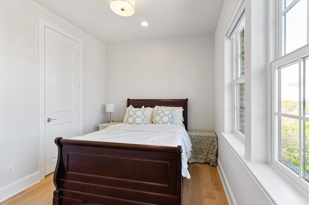 4129 Runyon Road Addison, TX 75001 - Photo 29 of 38 Bedroom with light wood-style flooring and recessed lighting