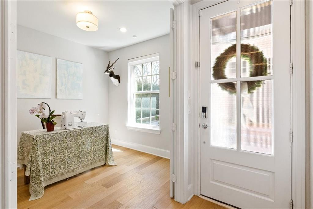 4129 Runyon Road Addison, TX 75001 - Photo 4 of 38 Doorway with wood finished floors and baseboards