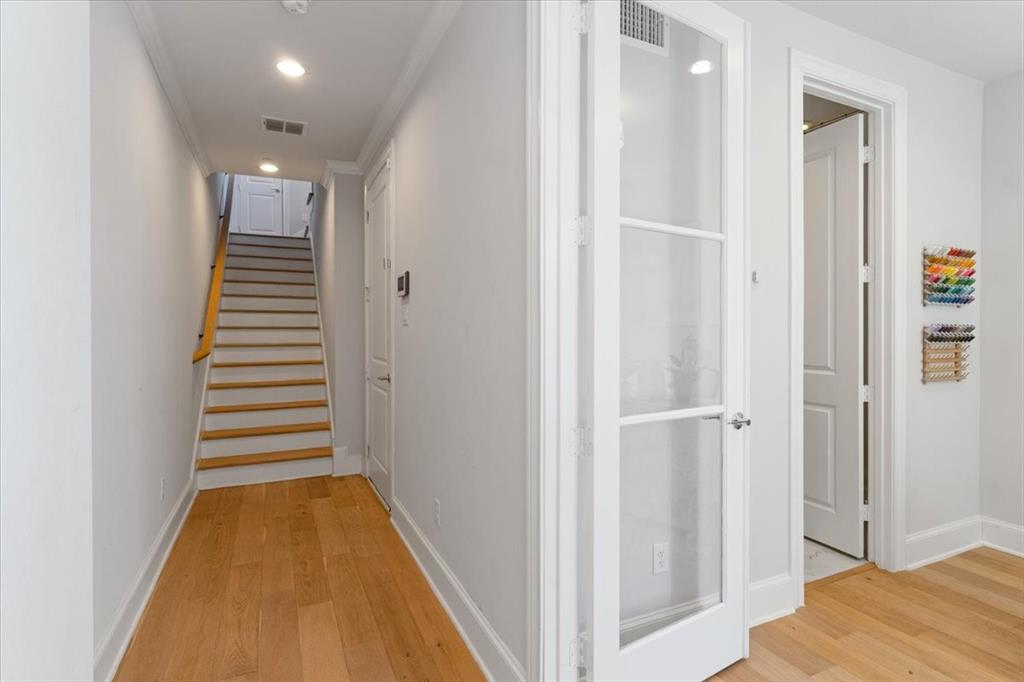 4129 Runyon Road Addison, TX 75001 - Photo 7 of 38 Corridor featuring light wood-style floors, recessed lighting, and crown molding