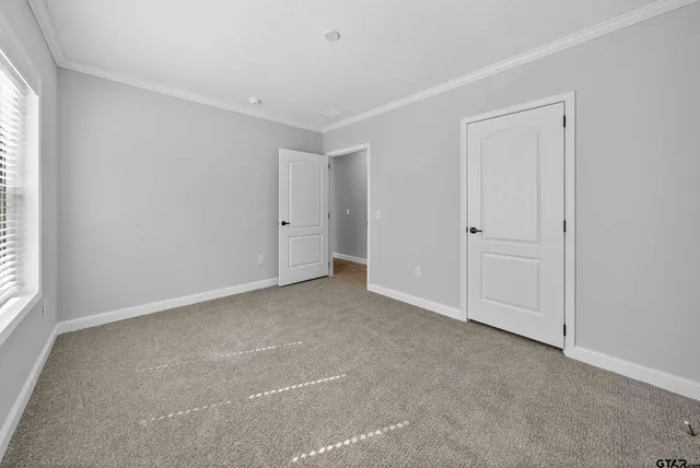 a view of an empty room and window