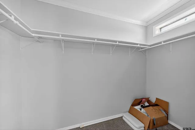 a view of room with racks on the wall