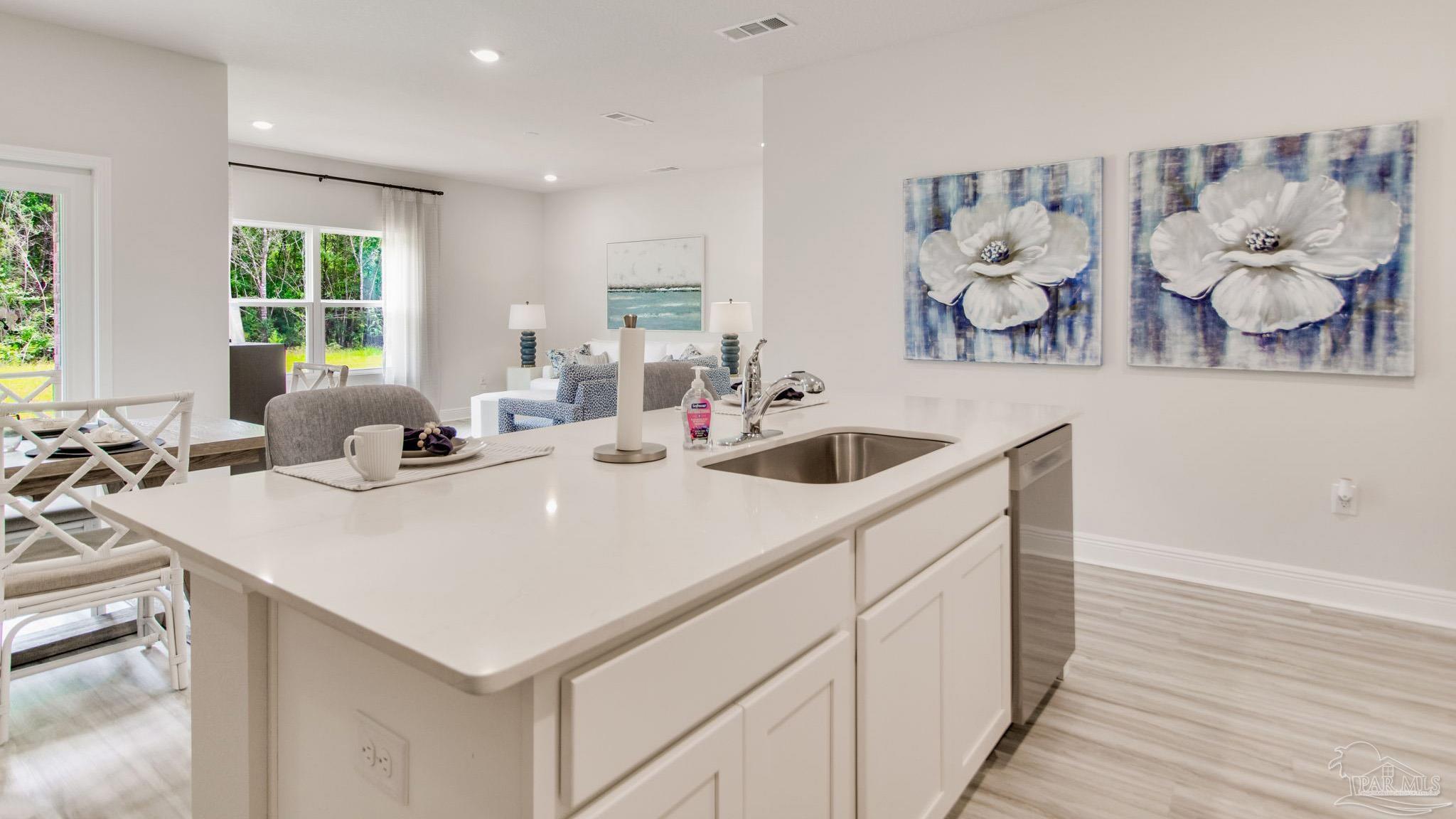 2796 Chevy Circle Pace, FL 32571 - Photo 5 of 31 a kitchen with a sink and cabinets