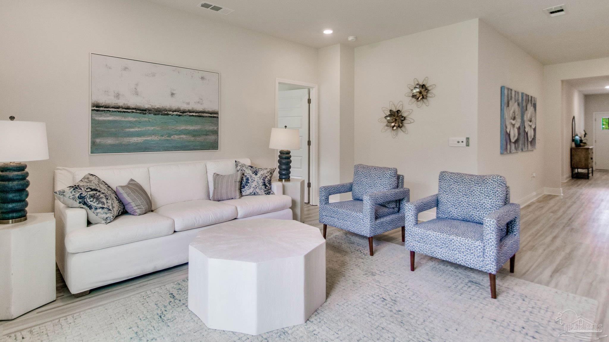 2796 Chevy Circle Pace, FL 32571 - Photo 10 of 31 a living room with furniture and a painting