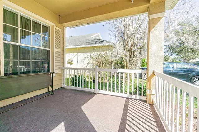 a view of a large window with wooden floor and fence