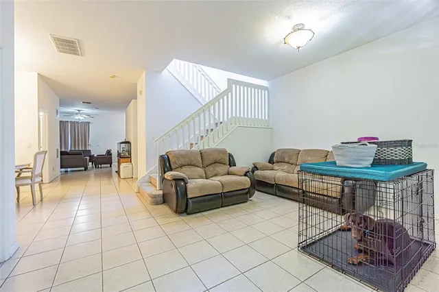 a living room with furniture and a table