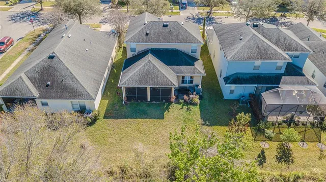 a aerial view of a house with a yard