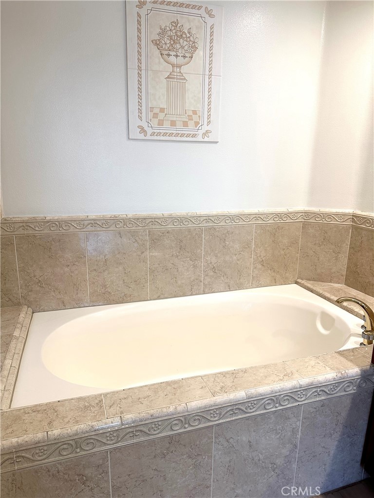 2243 Martin, Unit 117 Irvine, CA 92612 - Photo 13 of 16 a view of a bathtub in a bathroom