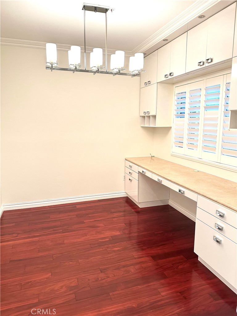 2243 Martin, Unit 117 Irvine, CA 92612 - Photo 3 of 16 a view of a kitchen with wooden floor and a window