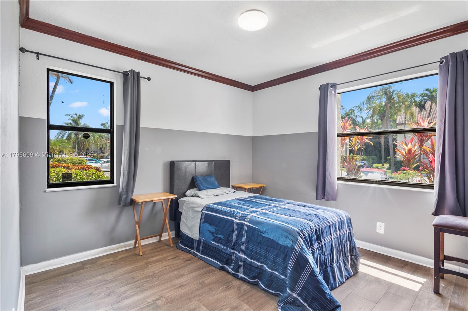 22053 Palms Way, Unit 106 Boca Raton, FL 33433 - Photo 11 of 17 a bedroom with a bed and a window