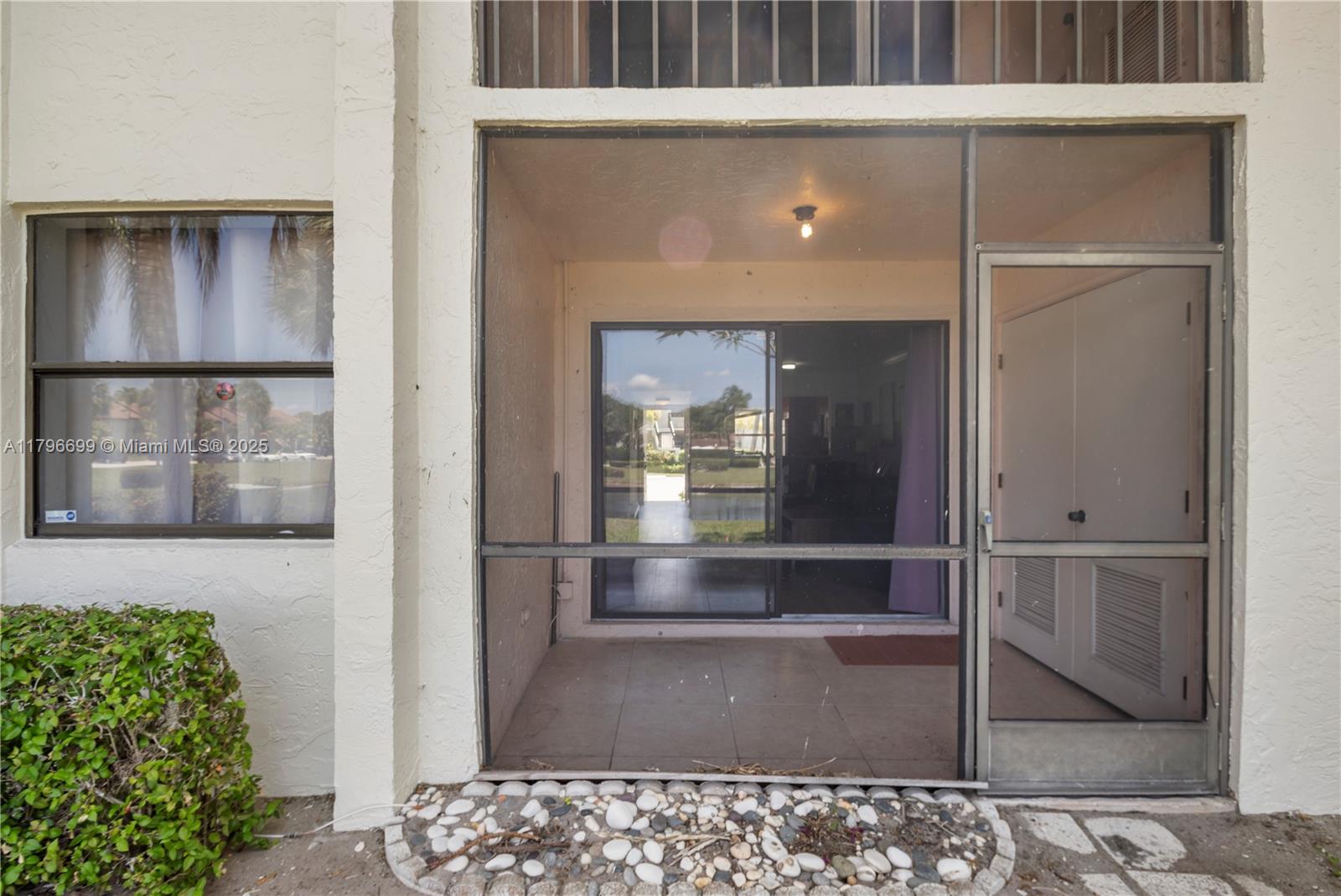 22053 Palms Way, Unit 106 Boca Raton, FL 33433 - Photo 14 of 17 a view of entryway