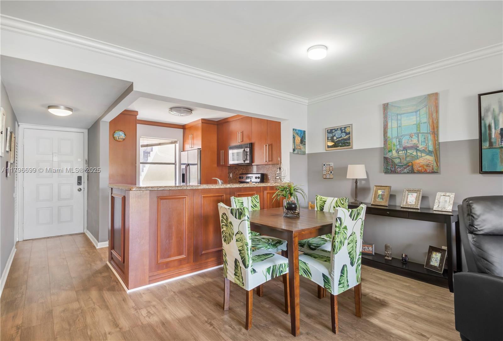 22053 Palms Way, Unit 106 Boca Raton, FL 33433 - Photo 6 of 17 a dining room with furniture and window