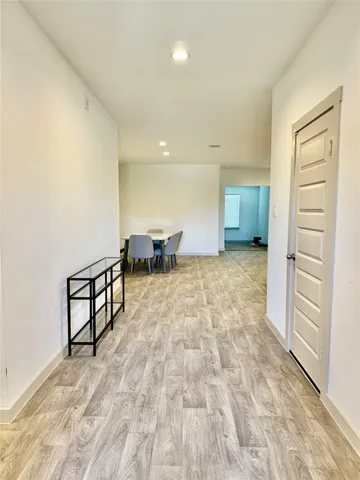 an empty room with a empty space and windows