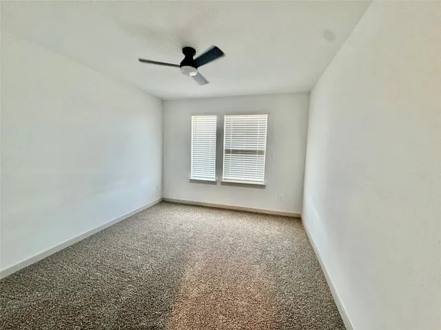 a view of a room with wooden floor and chair