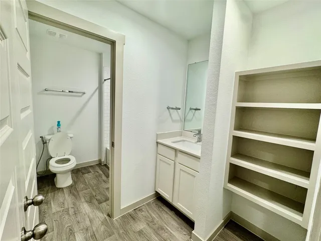 a view of a room with racks on the wall