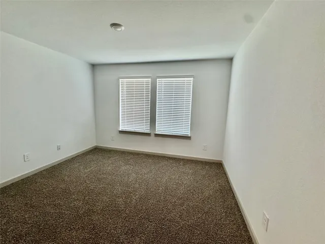 a bathroom with a shower sink and mirror