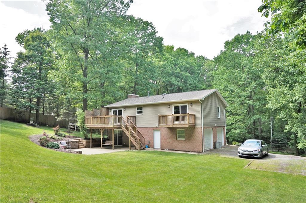 301 Beulah Road Chicora, PA 16025 - Photo 3 of 22 Rear deck and patio along with master balcony have new sliding doors!