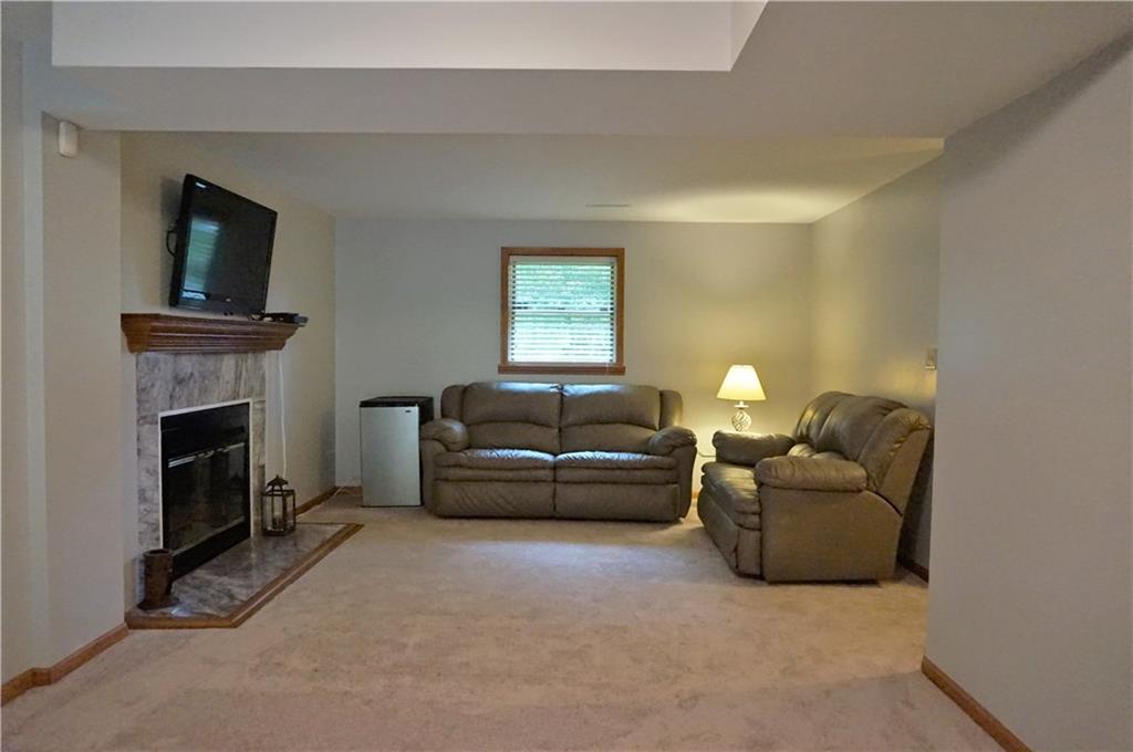 301 Beulah Road Chicora, PA 16025 - Photo 21 of 22 Family room in the lower level with wood burning fireplace!