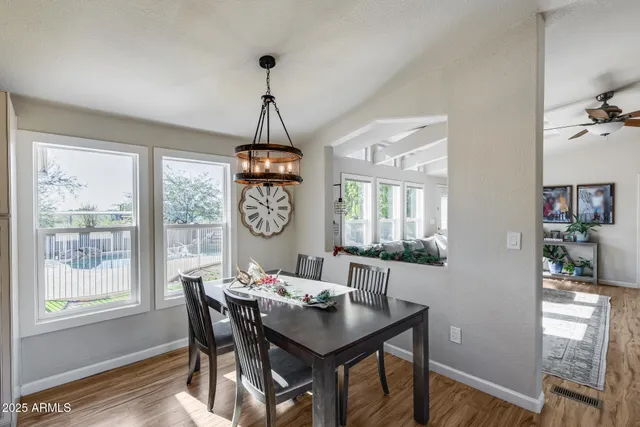 a bedroom with bed tv and a window