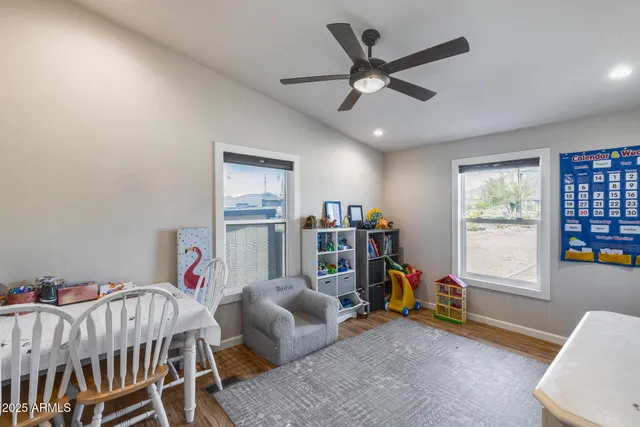 a view of a backyard with sitting area