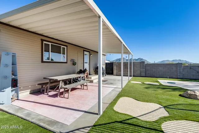 a view of a house with a yard and garage