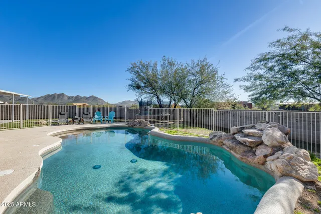 a view of house with backyard and garden