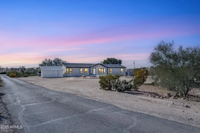 a view of a backyard with swimming pool