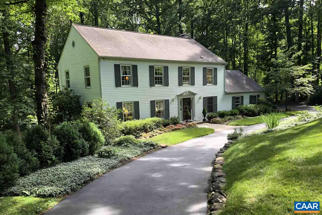 a front view of a house with a yard and porch