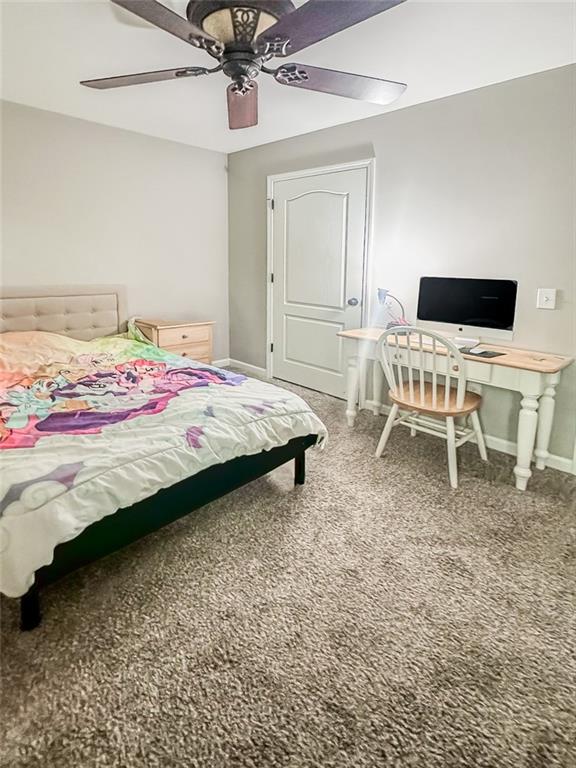 1485 Oglethorpe Run Lane Suwanee, GA 30024 - Photo 14 of 18 a bedroom with a bed and a chair