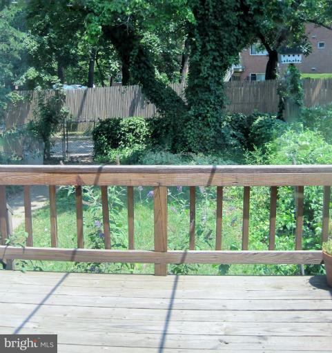 328 Stanmore Road Baltimore, MD 21212 - Photo 12 of 20 Rear deck overlooks landscaped fenced yard