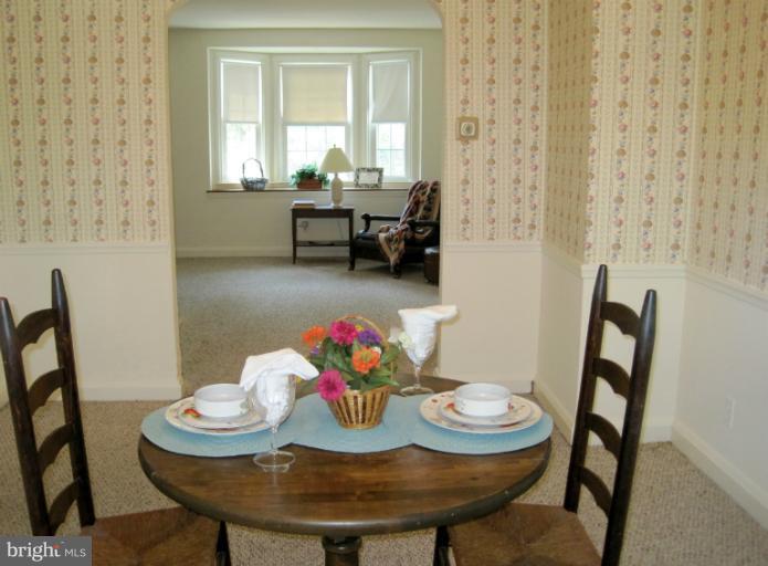 328 Stanmore Road Baltimore, MD 21212 - Photo 10 of 20 Separate DR features chair rail & double windows