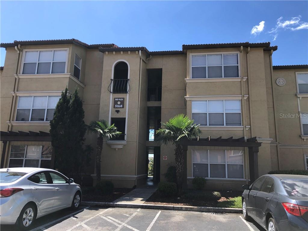 5168 Conroy Road, Unit 1624 Orlando, FL 32811 - Photo 1 of 1 a front view of a house with parking space