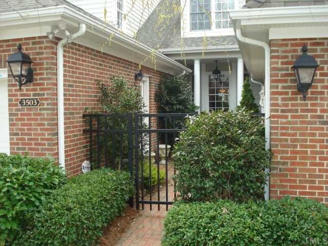 3503 Proprietor Way Raleigh, NC 27612 - Photo 1 of 12 a view of a brick house with plants and a flower plants