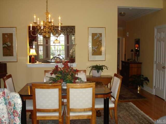 3503 Proprietor Way Raleigh, NC 27612 - Photo 5 of 12 a view of a dining room with furniture and chandelier