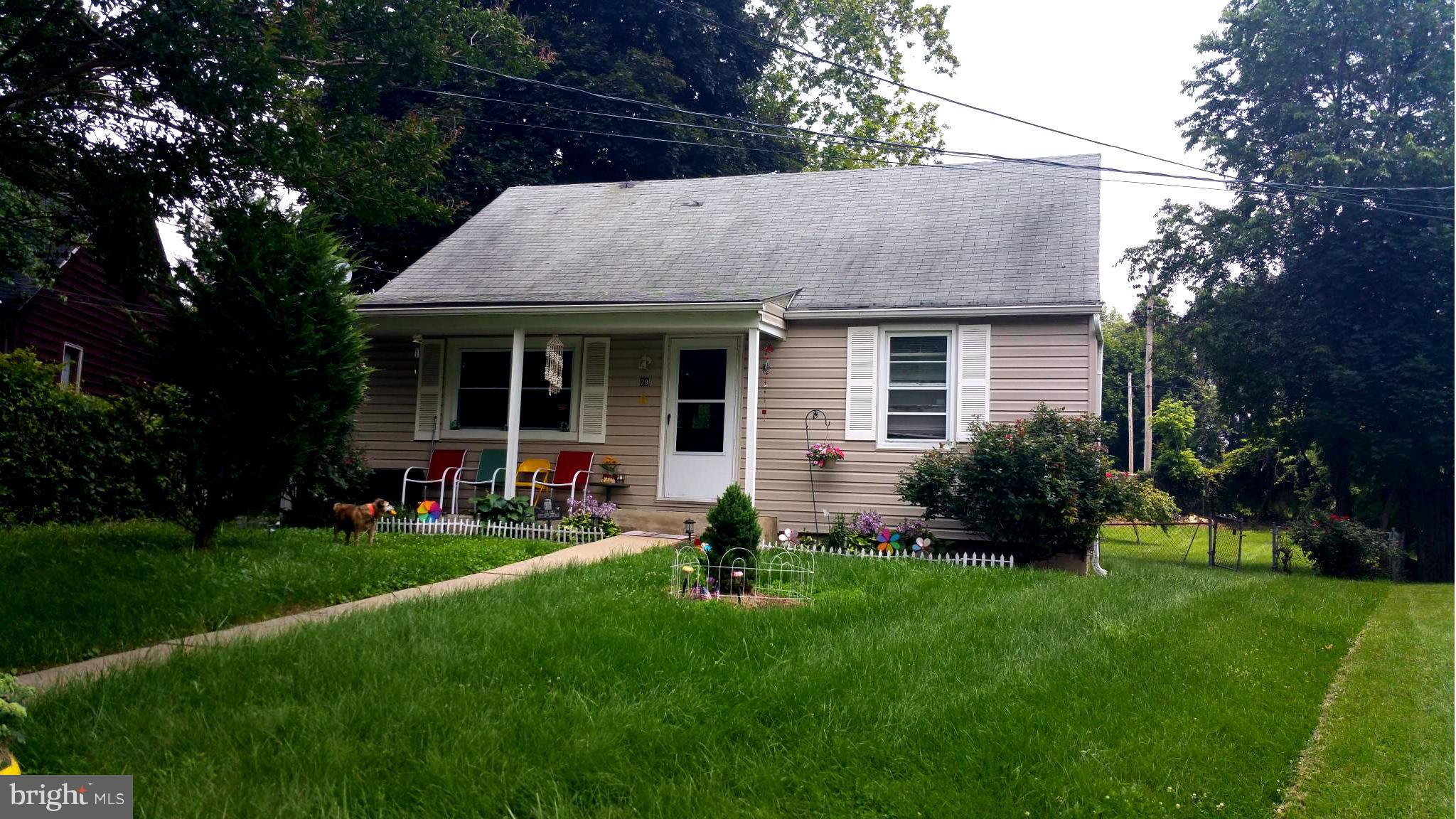 29 Village Road Baltimore, MD 21208 - Photo 1 of 15 a view of house with a yard and patio