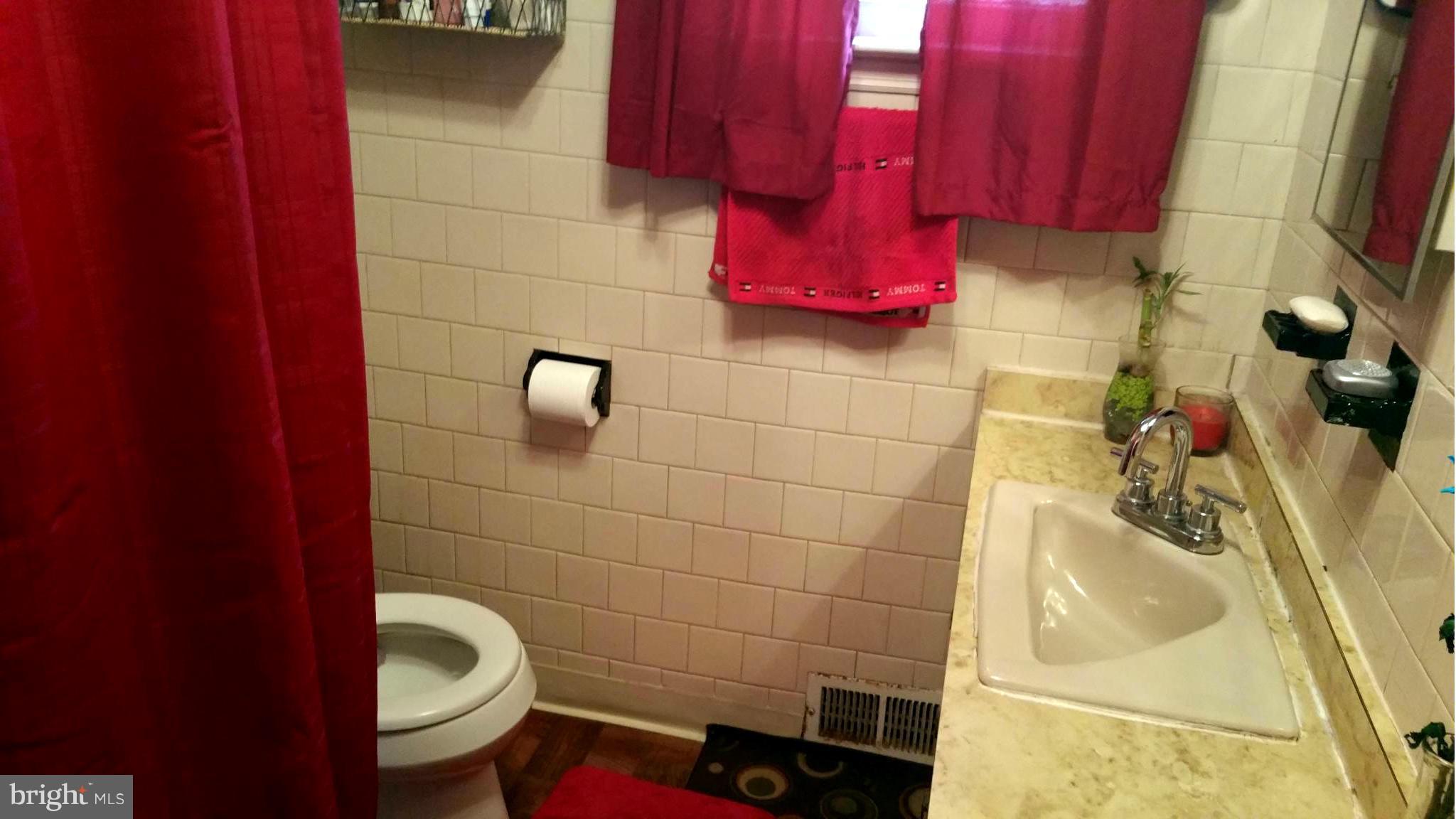 29 Village Road Baltimore, MD 21208 - Photo 13 of 15 a bathroom with a toilet and sink
