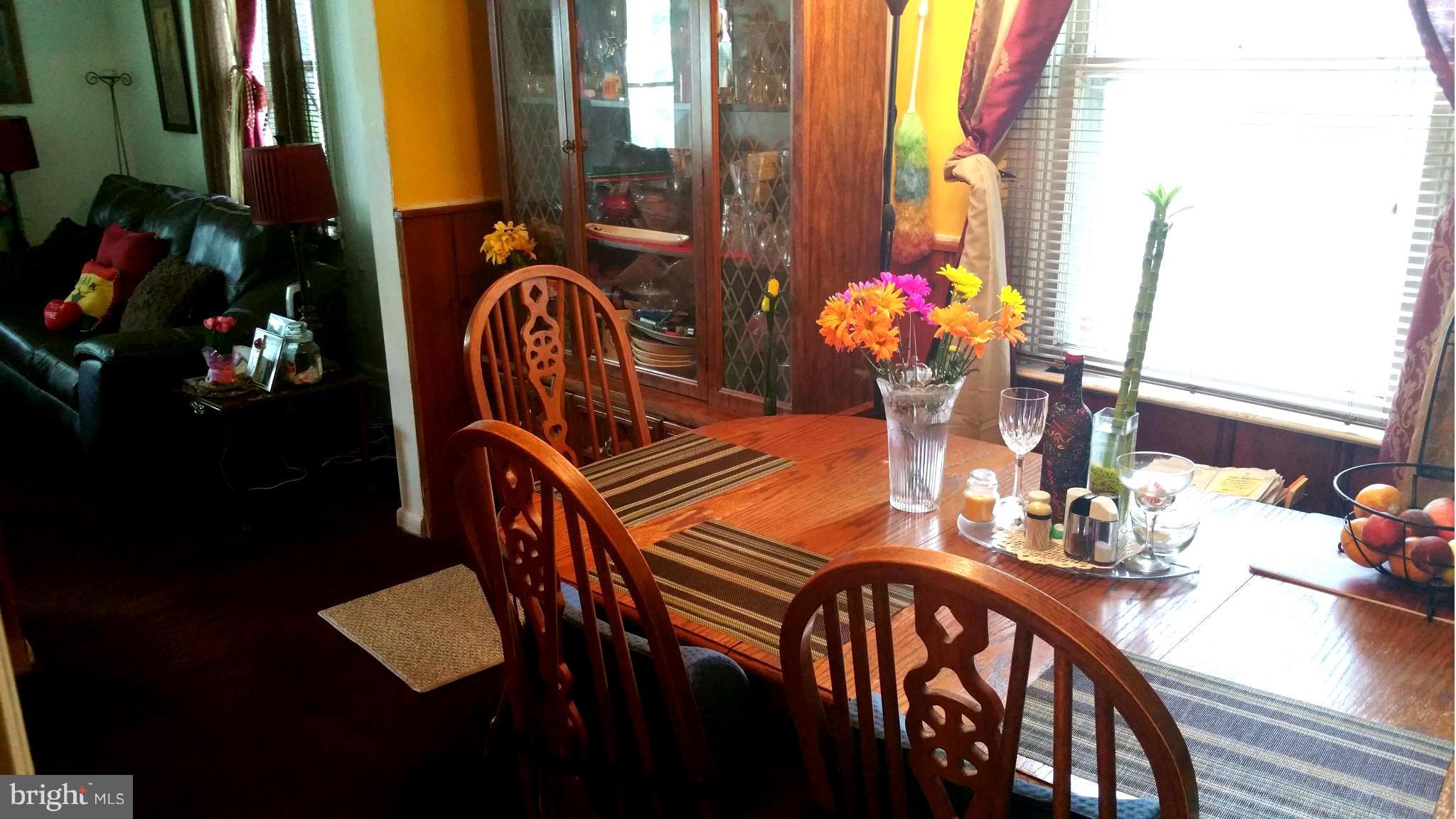 29 Village Road Baltimore, MD 21208 - Photo 4 of 15 a view of a dining room with furniture and chandelier