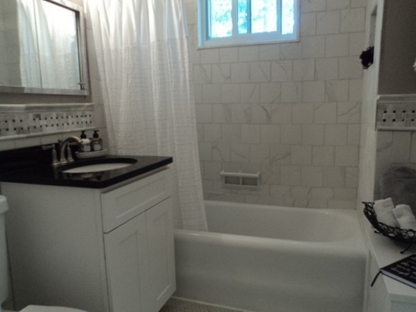 63 Hadwen Road Worcester, MA 01602 - Photo 21 of 29 a bathroom with a bathtub and a window