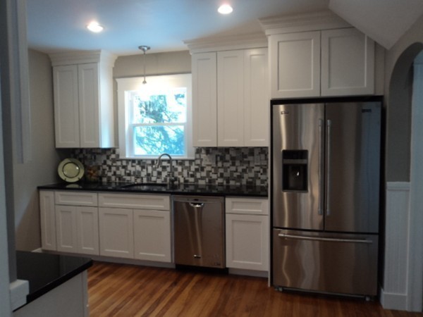63 Hadwen Road Worcester, MA 01602 - Photo 4 of 29 a kitchen with stainless steel appliances granite countertop a refrigerator sink and cabinets