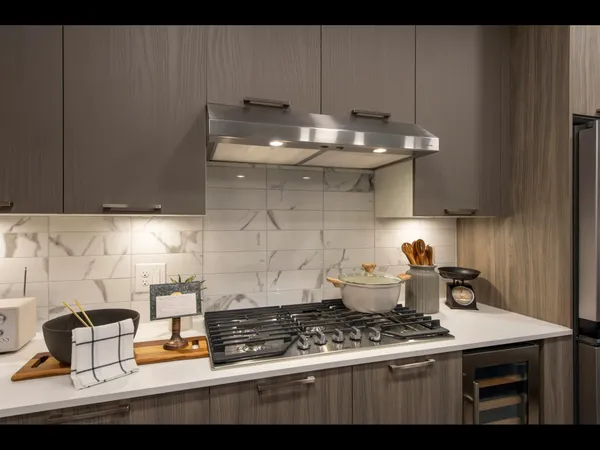 a kitchen with a stove and cabinets