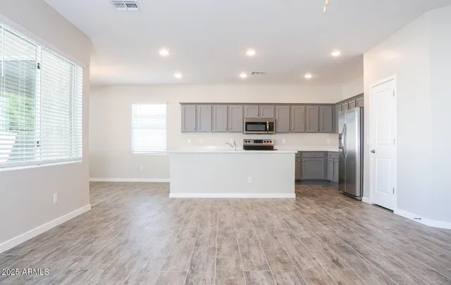 a view of kitchen with wooden floor