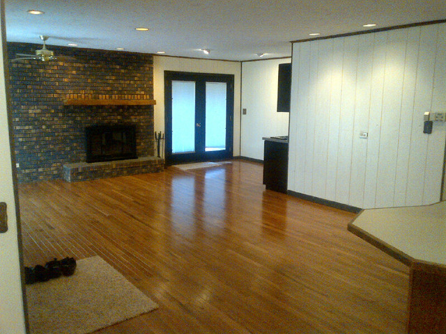 1730 Good Avenue Park Ridge, IL 60068 - Photo 11 of 24 an empty room with wooden floor and fireplace