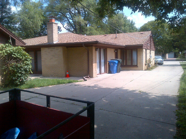 1730 Good Avenue Park Ridge, IL 60068 - Photo 23 of 24 a view of a house with a patio and a yard