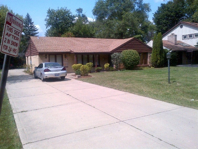 1730 Good Avenue Park Ridge, IL 60068 - Photo 24 of 24 a view of a house with a cars park side of a road