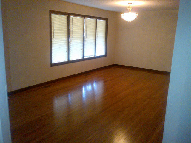 1730 Good Avenue Park Ridge, IL 60068 - Photo 3 of 24 an empty room with wooden floor and windows