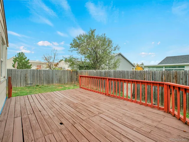 a front view of house with yard and outdoor seating