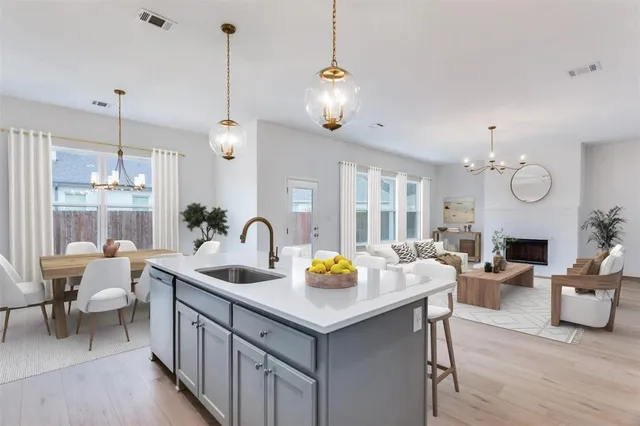 a view of living room with granite countertop furniture and fireplace