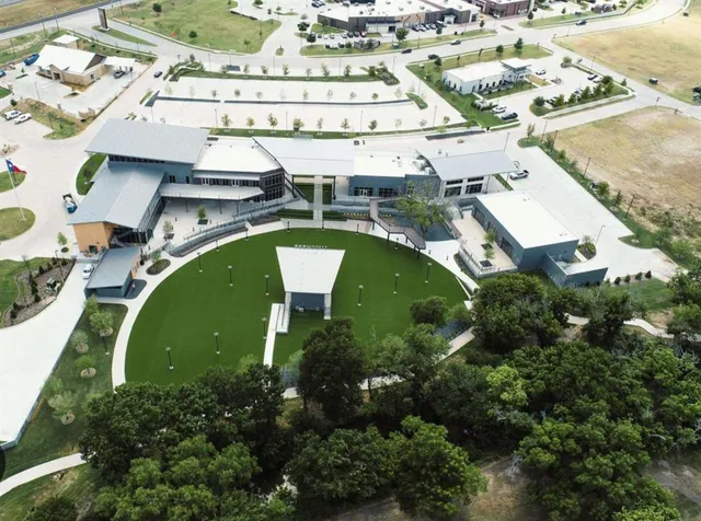 an aerial view of a house with a swimming pool