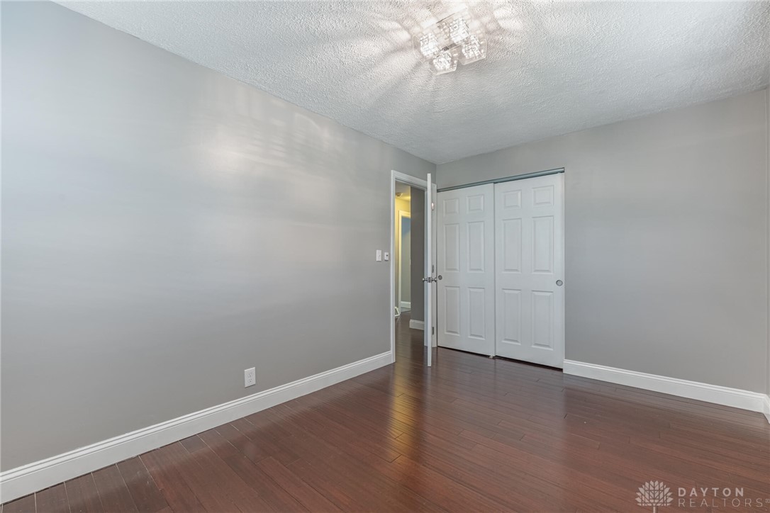 467 West Rahn Road Dayton, OH 45429 - Photo 17 of 41 This spacious room features rich wood flooring and ample closet space, ready for your personal touch.