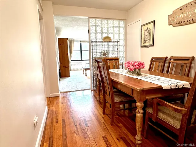 a view of a dining room with furniture and wooden floor